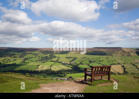 Empty bench overlooking Rosedale Moor with view to Esk Dale valley country landscape in North York Moors National Park. Yorkshire England UK Britain Stock Photo