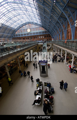 commuters waiting for Eurostar at St Pancras international station with barlow shed St Pancras is the key destination Stock Photo
