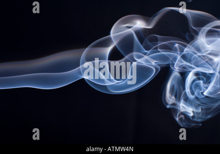 incense smoke on a black background Stock Photo