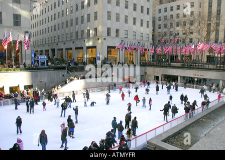 People ice skating on rink infront of Rockefeller Center, New York City, USA Stock Photo