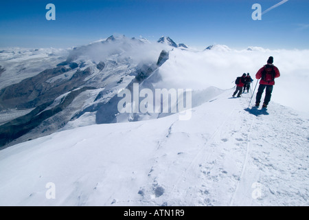 mountaineers on the Breithorn 4164 m with view of Monte Rosa 4634 m Zermatt Wallis Valais Switzerland Stock Photo