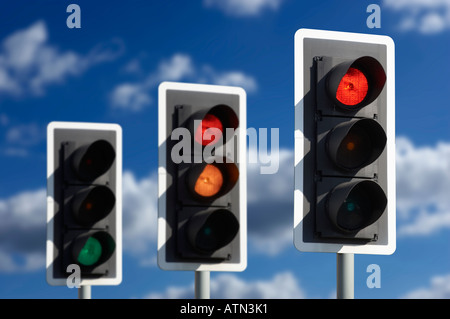 ROW OF THREE ROAD TRAFFIC LIGHTS SHOWING SEQUENCE OF RED AMBER AND GREEN Stock Photo