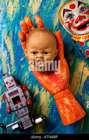 doll head held by wooden hand Stock Photo