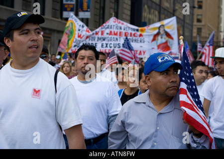 Chicago Illinois immigration rally worker carrying an American flag Stock Photo