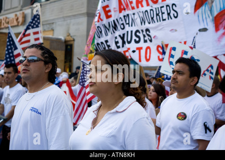 Chicago Illinois immigration rally worker carrying an American flag Stock Photo