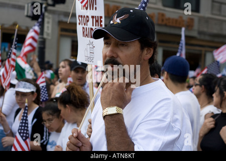 Chicago Illinois immigration rally worker carrying an American flag Stock Photo