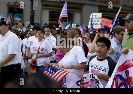 Chicago Illinois immigration rally worker carrying an American flag Stock Photo