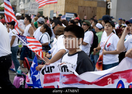 Chicago Illinois immigration rally worker carrying an American flag Stock Photo