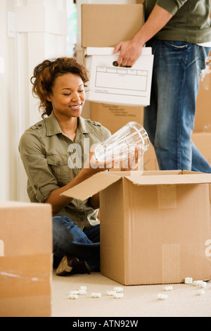 African couple unpacking in new house Stock Photo