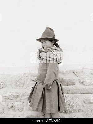 Young Ayamara Quechua Indian girl child in a street in Cusco Cuzco in the Peruvian Andes in Peru in Latin South America. Lifestyle Travel Stock Photo