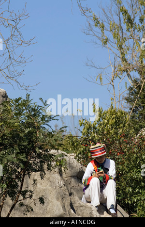 Yi Girl, Shi Lin Stone Forest, near Kunming, Yunnan Province, China Stock Photo