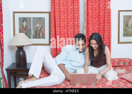 Young couple working on a laptop Stock Photo