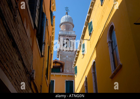 Venice, Veneto, Italy. View along colourful street to bell-tower of the Chiesa di San Pantalon. Stock Photo