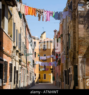 Venice, Veneto, Italy. A residential street in the Castello district, washing hanging out to dry. Stock Photo