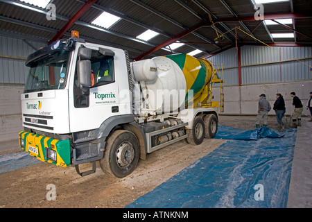 Cement lorry unloading cement for barn floor Cotswolds UK Stock Photo