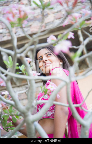 Side profile of a young woman smiling Stock Photo