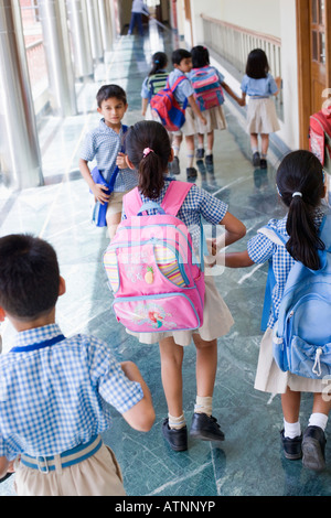 High angle view of students walking in a corridor Stock Photo