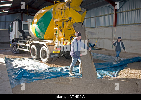 Cement lorry unloading cement for barn floor Cotswolds UK Stock Photo