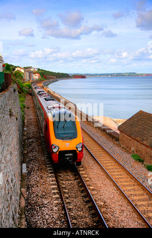 Virgin Voyager 221 class diesel train on its way from Dawlish station Dawlish Seawall Devon England UK Stock Photo