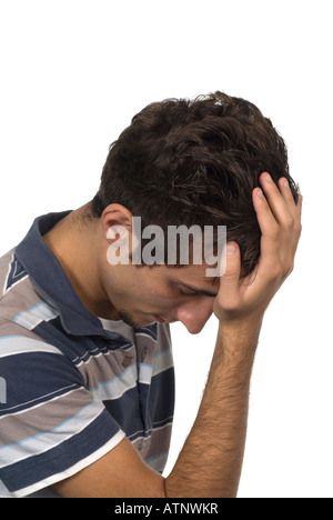 Depressed teenage boy head in hand on a white background Stock Photo
