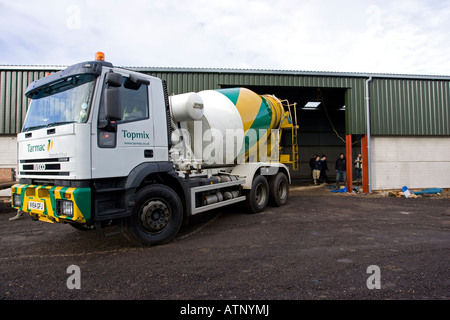 Cement lorry unloading cement for barn floor Cotswolds UK Stock Photo