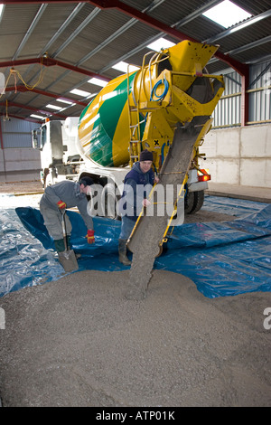 Cement lorry unloading cement for barn floor Cotswolds UK Stock Photo