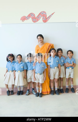 Group Of Elementary Age Schoolchildren Standing Outside Stock Photo - Alamy