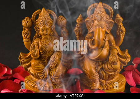 Close-up of a statue of Lord Ganesha and Goddess Lakshmi Stock Photo