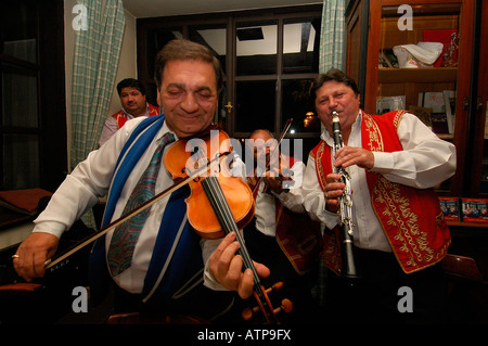 Hungarian gypsy band playing for guests Csardas or Czardas traditional Hungarian folk dance in Kehli restaurant Budapest Hungary Stock Photo