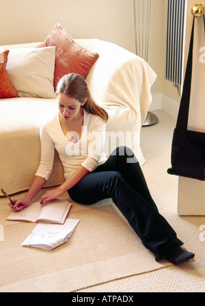 Young woman checking personal finances Stock Photo