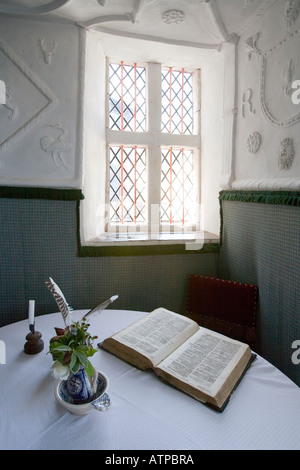 Light streaming through window onto book on table Plas Mawr Conwy Wales UK Stock Photo