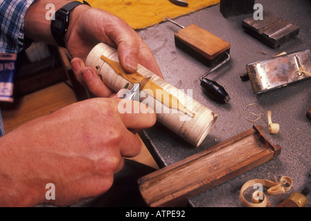 Cutting the reed for Uilleann Pipes which are  Irish Bagpipes made by Eugene Lambe  each set of pipes  has seven reeds. Stock Photo