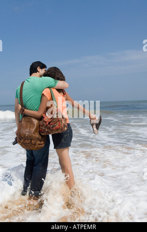 Young couple embracing each other on the beach Stock Photo