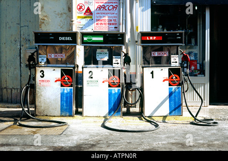 Oct 4, 2007 - Gas pumps at a filling station in front of a car service point in the town of Xaghra on the Maltese island of Gozo Stock Photo