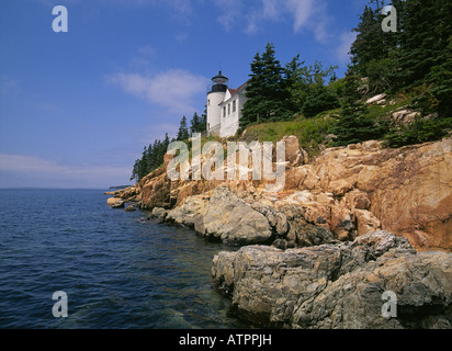 A view of a rocky shoreline and Bass Harbor Lighthouse in the Mount Desert Island section of Acadia National Park Stock Photo