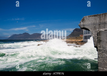 Fish Hoek harbour with crashing waves on the False Bay coast of Cape Peninsula near Cape Town South Africa Stock Photo