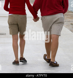 couple walking together holding hands