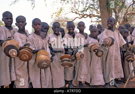 Dogon boys performing by the roadside to raise money for their circumcision ceremony, Mali Stock Photo