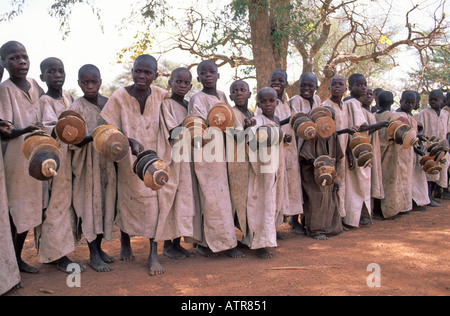 Dogon boys performing by the roadside to raise money for their circumcision ceremony, Mali Stock Photo