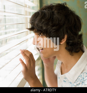 Profile of a Teenage Indian Boy Looking at outsides Stock Photo