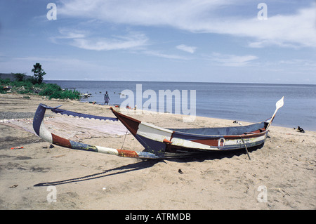 A traditional Luo sailing canoe moored on a beach of Rusinga Island Lake Victoria Kenya East Africa Stock Photo