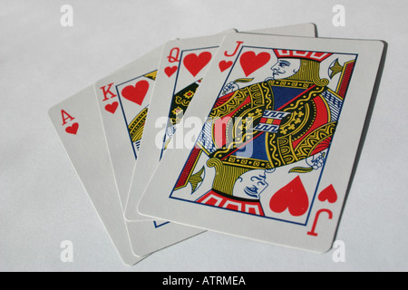 Ace, King, Queen and Jack of Hearts playing cards in a fan shape