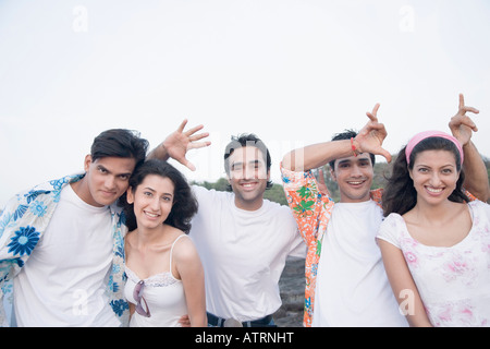 Portrait of three young men and two young women having fun Stock Photo