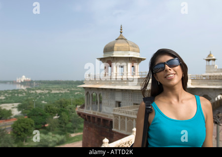 Close-up of a young woman smiling, Taj Mahal, Agra, Uttar Pradesh, India Stock Photo