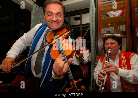 Hungarian gypsy band playing for guests Csardas or Czardas traditional Hungarian folk dance in Kehli restaurant Budapest Hungary Stock Photo