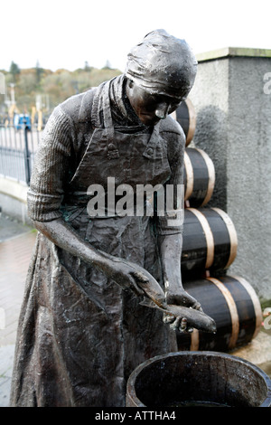 Bronze Statue of the Herring Girl at Stornoway Harbour, Lewis Western Isles Stock Photo