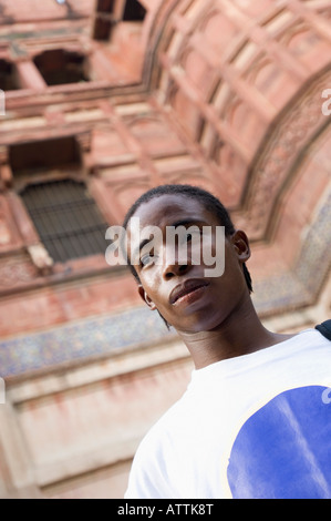 Low angle view of a young man looking away, Taj Mahal, Agra, Uttar Pradesh, India Stock Photo