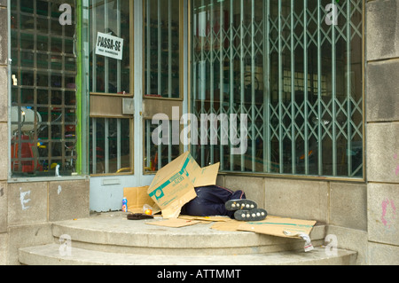Man sleeping under cardboard boxes in Porto Portugal Stock Photo