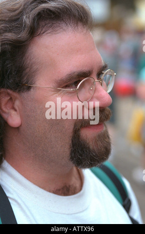 Bearded man age 27 looking happily into distance. Minnesota State Fair St Paul Minnesota USA Stock Photo