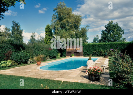 Outdoor swimming pool in garden of house Stock Photo